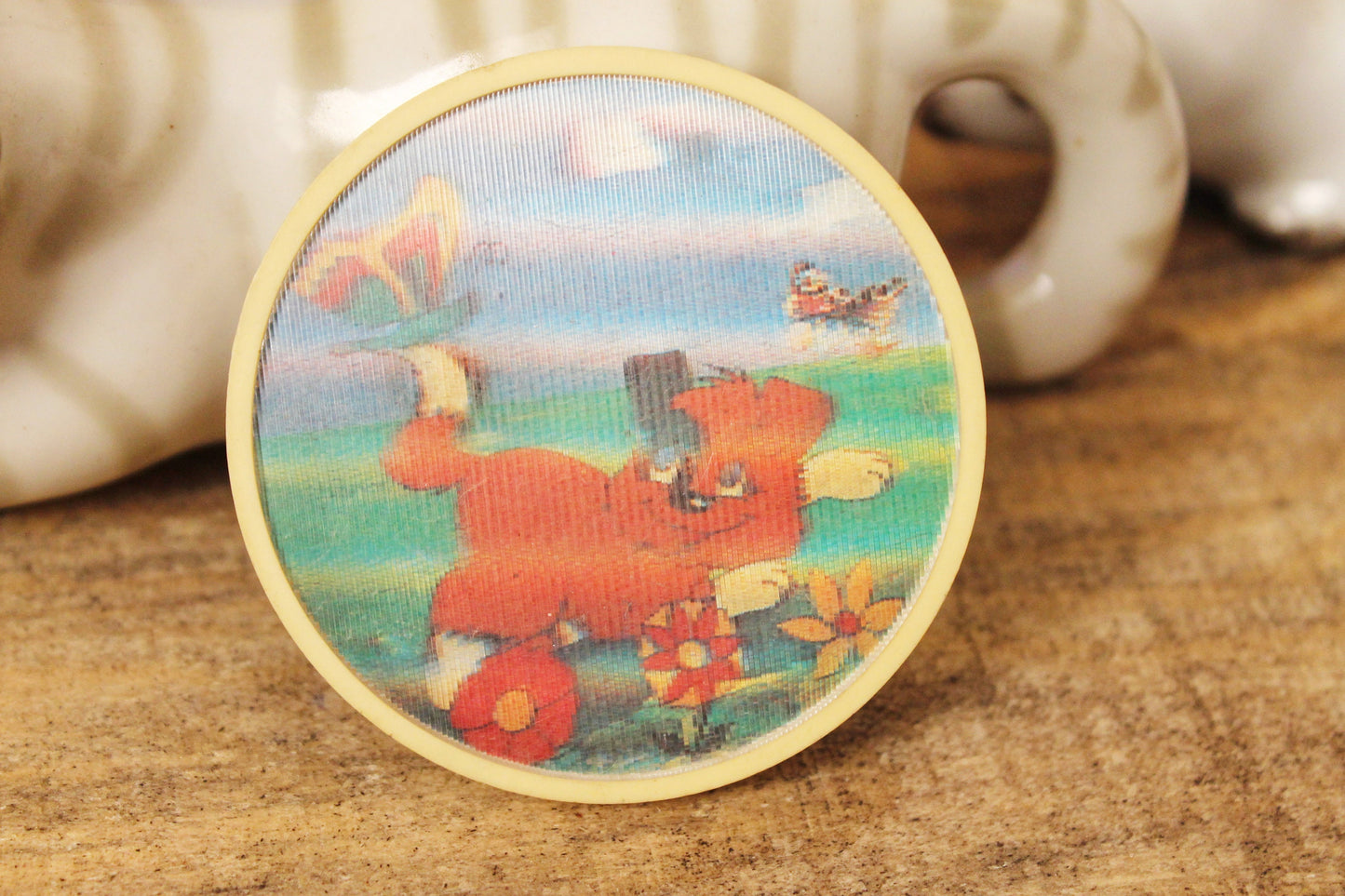 Soviet children's round plastic pin badge with a cartoon puppy - made in USSR, 1970s
