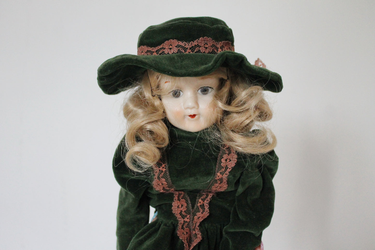 Vintage German Porcelain Doll in Green Velvet Dress with Hat – Fabric Body – Handcrafted Look – Visible Leg Repair - 1960-1980s