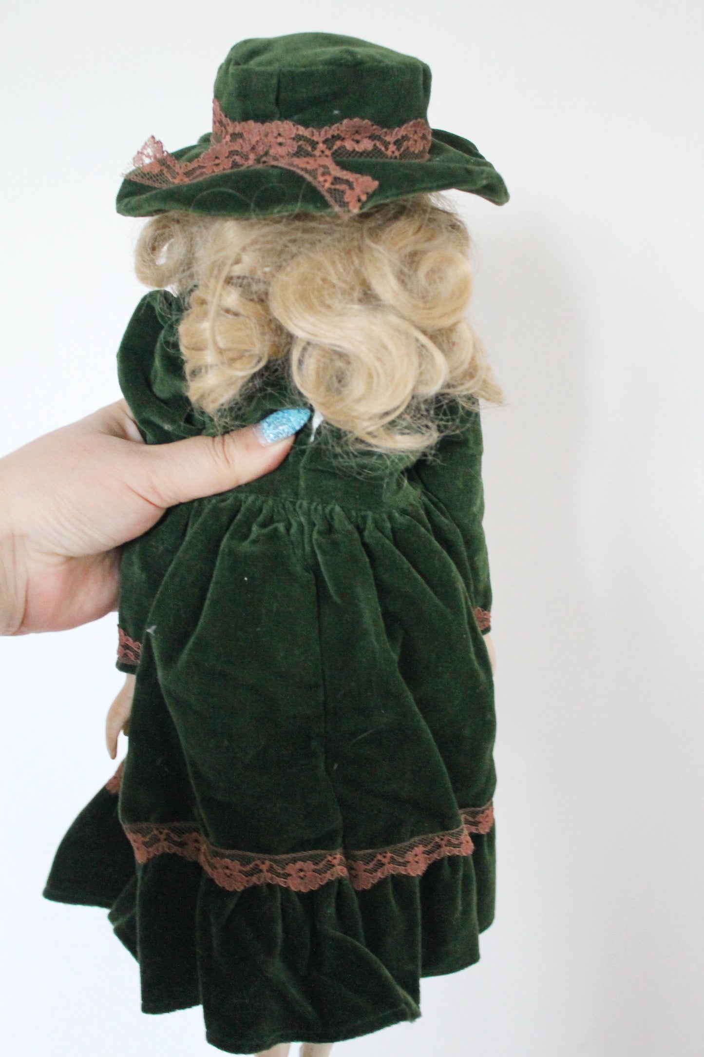 Vintage German Porcelain Doll in Green Velvet Dress with Hat – Fabric Body – Handcrafted Look – Visible Leg Repair - 1960-1980s
