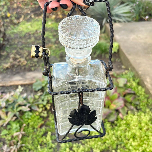 Vintage German Glass Liquor Bottle in Wrought Iron Cage with Decorative Stopper and Lock